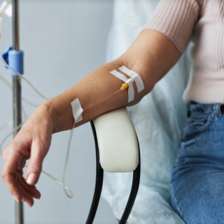 Close-up shot of blood being drawn from a forearm