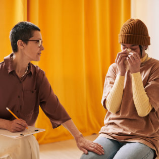 Woman comforting a crying patient