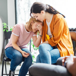 Woman reassuring a patient